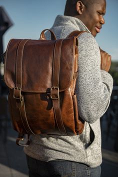 Moore & Giles' Crews Backpack is a fresh, streamlined take on a traditional shape. Its tastefully two-tone exterior is luxuriously tailored while also exuding a laid back vibe. As for interior features, there's no shortage of sections and pockets, so whether you're a student, commuter, or frequent trekker, you can always look forward to exceptional organization and versatility. About Titan Milled Leather This Italian leather combines chrome and vegetable tanning, revealing a smooth, vibrant surf Luxury Men's Backpack With Leather Backing, Luxury Men's Leather Backpack, Luxury Men's Backpack For On-the-go, A Student, Leather Bags, Italian Leather, Classic Looks, Backpack Bags, Leather Bag