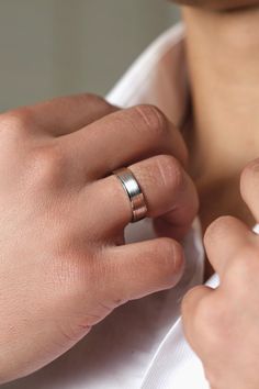 a person wearing a ring on their left hand