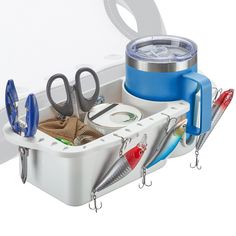 a white box with scissors and other items in it