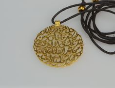 "Handmade Islamic necklace, Arabic Quran SURAT AL-FALAQ verse necklace, handmade calligraphy necklace. Gift for her A very beautiful piece of art necklace with Quran Arabic verse totally handmade without any interfere of any machinery The verse is Surat Al-Falaq (The Daybreak) and its words are as follows Say, \"I seek refuge in the Lord of daybreak -------- قُلْ أَعُوذُ بِرَبِّ الْفَلَقِ From the evil of that which He created ---------- مِن شَرِّ مَا خَلَقَ And from the evil of darkness when it Gold Necklace With Artistic Round Pendant, Gold Necklace With Artistic Design And Round Pendant, Gold Necklace With Round Pendant And Artistic Design, Adjustable Spiritual Necklace With Artistic Design, Spiritual Necklace With Artistic Design As Gift, Adjustable Spiritual Necklaces With Artistic Design, Gold Necklace With Artistic Design For Gift, Gold Necklaces With Artistic Design For Gift, Customized Pendant Necklaces