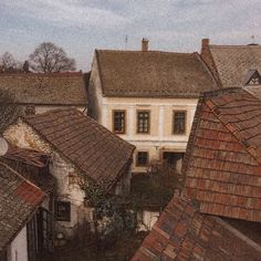 an aerial view of rooftops and old buildings