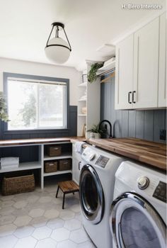 a washer and dryer in a small room