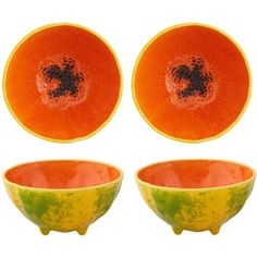 three orange and yellow bowls with black speckles on the top one is empty