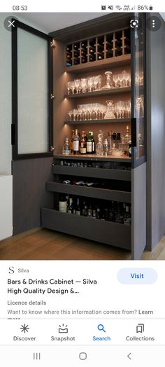 an image of a bar with wine glasses on the top shelf and shelves below it