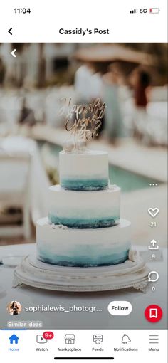 a three tiered cake sitting on top of a table next to a swimming pool