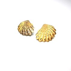 Vintage seashell earrings, gold toned finished.post back earrings. Sea shell jewelry, nautical.  Scallop shell earrings.Beach seaside jewelry, summertime bling.    Size of earrings:1" x .75" or 2.5 x 1.8 cm approxinatelyCondition:Fair.  A fair amount of wear on the front.  The finish is worn away a bit and tarnish on the underside. See photos above.  There are no back to the posts.  Would be lovely worn or re-purposed!You might like:http://www.etsy.com/listing/103610925/strawberry-purse-basket-c Gold Brass Shell-shaped Earrings, Gold Shell-shaped Brass Earrings, Gold Shell With Matching Earrings, Gold Brass Shell Earrings, Gold Shell Earrings For Summer, Shell-shaped Gold Shell Earrings, Gold Shell-shaped Shell Earrings, Gold Shell-shaped Earrings, Ocean-inspired Gold Shell Earrings