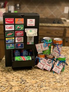 an assortment of sodas and snacks are on the counter