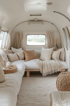 a living room filled with lots of white furniture