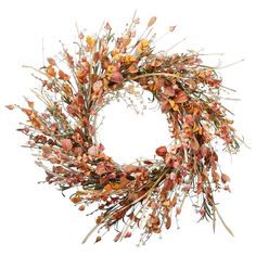 an orange wreath with dried flowers and leaves