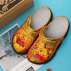 Introducing our delightful Winnie The Pooh Clogs Shoes Gift! These charming clogs feature everyone’s favorite honey-loving bear, Winnie the Pooh, Themed Crocs, Shoe Crocs, Crocs Ideas, Yellow Crocs, Crocband Clog, Crocs Clog, Versatile Shoes, Crocs Crocband, Crocs Clogs