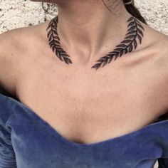 a woman with a tattoo on her chest