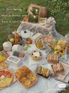 a picnic table covered in food and snacks