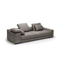 a gray couch with pillows on top of it