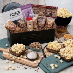 the popcorn box is filled with snacks and other items to make it look like they are ready