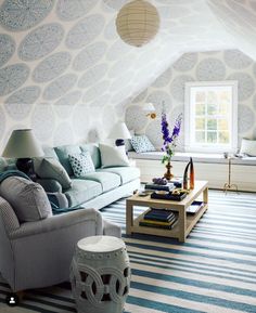 a living room with blue and white decor