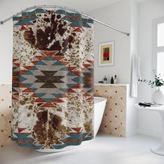 a bathroom with a bathtub, shower curtain and rug on the floor in front of it