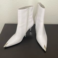 Questions? Leave A Comment Below! Jeffrey Campbell White Booties With Silver Tip And Heels. Excellent Condition With Sticker Residue On Soles. 3 1/2” Heel Make Them A Practical Choice! White Heeled Boots With Sculpted Heel And Pointed Toe, White Pointed Toe Heeled Boots With Sculpted Heel, White Pointed Toe Boots With Sculpted Heel, Chic Synthetic Booties With Pointed Toe, High Heel Boots With Metal Feet For Spring, High Heel Boots With Metal Details For Spring, Pointed Toe Booties With Reinforced Heel In Synthetic Material, Synthetic Pointed Toe Booties With Reinforced Heel, White Pointed Toe Heels With Heel Tab