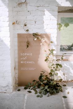 there is a sign that says sophiie and michael on the wall next to it