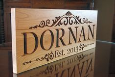 a wooden sign that says dornan on it