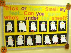 a bulletin board decorated with white paper ghostes and words that read trick or treat smell my feet can you guess who's under the sheet?