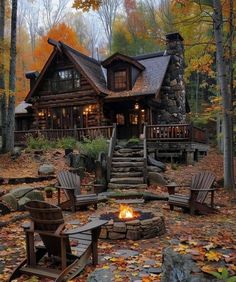 a log cabin in the woods surrounded by fall leaves and fire pit with adiron chairs