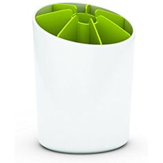 a white cup with green dividers in it on a white surface, showing the top portion of the cup