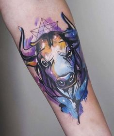 a bull tattoo on the left arm