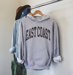 Minimalist East Coast Hoodie, East Coast Fan Crewneck Sweatshirt, boho East Coast Sweatshirt, East Coast Gift, College Student gift ◦ ◦ ◦ ◦ ◦ size and material ◦ ◦ ◦ ◦ ◦ ◦ RUNS TRUE TO SIZE ◦ PLEASE SIZE UP FOR A RELAXED FIT ◦ IF YOU WANT AN OVERSIZED LOOK PICK A SWEATSHIRT THAT IS 2-3 SIZES LARGER THAN YOUR USUAL SIZE ◦ ◦ UNISEX ◦ Gildan brand ◦ 50% cotton, 50% polyester ◦ Without side seams ◦ Spacious pockets ◦ ◦ ◦ ◦ ◦ care instructions ◦ ◦ ◦ ◦ ◦ ◦ Machine wash: warm (max 40C or 105F);  ◦ Blea Charles Bukowski, Unisex Sweater, Bukowski, Oahu Hawaii, Minsk, Limassol, Nashville Tennessee, Pullover Shirt, Laguna Beach