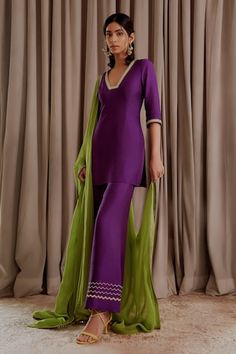 Purple silk short kurta with mirror and kasab embroidered neckline and cuffs. Comes with palazzo and a parrot green organza dupatta. - Aza Fashions Purple And Green Dress Outfit, Short Suit Outfit Women Indian, Parallel Suits Indian, Purple Kurta Set Women, Short Kurta Suits Women, Short Kurta Sets For Women, Kurta Necklines Design, Purple Kurta Woman, New Traditional Dress Design