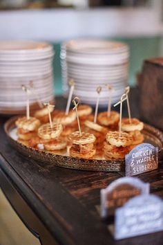 some food is sitting on a table with plates