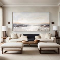 a living room filled with furniture and a large painting on the wall above it's couches