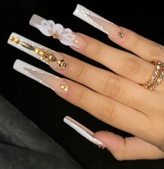 Extra Nails Acrylic Diamonds, Long Acrylic Nails Coffin 3d Flowers, White Nails With Gold Gems, White And Gold Quince Nails, White Extra Nails, White Long Acrylic Nails With Diamonds, White And Gold Birthday Nails, 3d Flower Nails Coffin, White Quince Nails