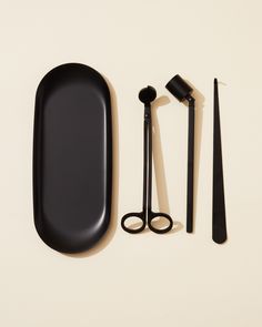 an assortment of black items on a white surface