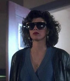 a woman wearing sunglasses and a leather jacket