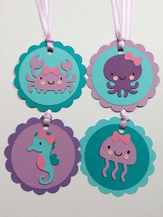 four tags with sea animals on them