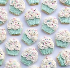 there are many cupcakes with frosting on them and sprinkles