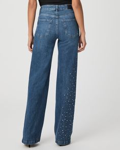 Be a showstopper this season in our crystal-embellished Sasha jeans. This high-rise wide leg is designed with a fitted top block and a slightly relaxed fit in a medium wash with marble texture throughout. This pair is crafted from our PAIGE VINTAGE denim which takes all of the work out of breaking in your favorite pair of vintage jeans. We've combined the comfort of stretch with everything you love about authentic vintage denim to create super soft jeans that feel perfectly lived-in from the ver Embellished Denim Blue Straight Leg Bottoms, Crystal Embellished Denim Jeans, Chic Straight Leg Bottoms With Rhinestones, Chic Embellished Denim Jeans, Chic Straight Leg Jeans With Rhinestones, Embellished Flare Jeans For Spring, Elegant Embellished Denim Bottoms, Chic Rhinestone Jeans For Spring, Soft Jeans