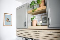 a washer and dryer in a small room