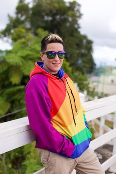 Introducing our Rainbow Color Block Hoodie, a vibrant and cozy expression of pride! Made with love, this genderless hoodie features a soft outside with a bright all-over print showcasing the colors of the rainbow. Crafted from a blend of 95% recycled polyester and 5% spandex, this hoodie offers comfort and sustainability in one. The fabric weight of 9.08 oz./yd.² (308 g/m²) ensures a soft and luxurious feel while the brushed fleece inside provides an additional layer of warmth. The double-lined hood with a color block design on both sides adds a stylish touch to this already incredible piece. With its relaxed fit and accompanying drawstrings, this hoodie is perfect for embracing your LGBTQIA+ Pride or just showcasing your love for color. Plus, the overlock seams ensure durability for every Multicolor Hoodie Sweatshirt With Kangaroo Pocket, Rainbow Long Sleeve Hoodie For Winter, Rainbow Long-sleeve Winter Hoodie, Rainbow Long Sleeve Winter Hoodie, Rainbow Cotton Hooded Hoodie, Rainbow Cotton Hoodie, Casual Rainbow Hoodie For Streetwear, Rainbow Hoodie For Winter Streetwear, Pride Hoodie