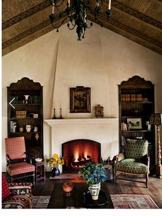 a living room filled with furniture and a fire place