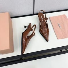 Size: 35-47 It comes with Dust box, Care manual, Tag, and Paper bag.Size Guide: Modern Brown Patent Leather Heels, Designer Brown Patent Leather Heels, Designer Brown Heels For Office, Size Guide, Clutch Bag, Paper Bag, Things To Come, Shoulder Bag, Tote Bag