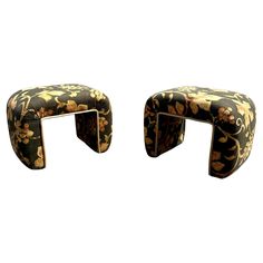 a pair of stools made out of fabric with flowers on the back and sides