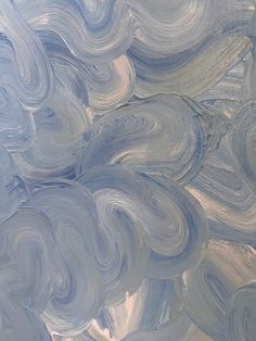 an abstract painting with blue and white swirls in the sky, as seen from above