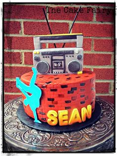 a cake that is decorated with an old radio and the words sean on it