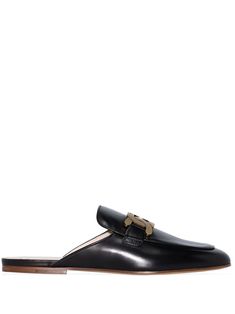 Black leather Sabot loafer mules from TOD'S featuring gold-tone logo plaque, round toe, slip-on style, tonal stitching, branded leather insole and flat leather sole. | Tod's Sabot loafer mules Black Sandals Flat, Tods Shoes, Loafer Mules, Leather Slippers, Crossbody Tote, Leather Gloves, Mule Clogs, Mules Shoes, Leather Accessories