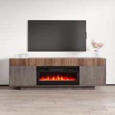 an entertainment center with a fireplace in the middle and a flat screen tv above it