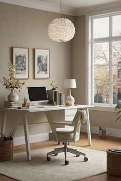 a desk with a laptop computer on top of it in front of a large window