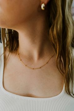 Our Dainty Gold Ball Chain Necklace is the perfect layering piece for your jewelry collection! Made with 24K Gold Filled metal, this necklace will not tarnish and is water prooff. Length: 18 InchesWidth : 1.3MM, BEAD-3.0MMIt has a spring clasp closure. Satellite Chain Charm Choker Necklace, Satellite Chain Charm Choker Necklaces As Gifts, Satellite Chain Charm Choker Necklace As Gift, Satellite Chain Choker Jewelry Gift, Choker Charm Necklaces With Satellite Chain For Gifts, Satellite Chain Necklace As A Gift, Satellite Chain Choker As Gift, Gold-plated Satellite Chain Necklace, Satellite Chain Necklace Gift