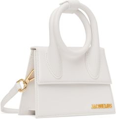 Buffed leather top handle bag in white. · Detachable and adjustable shoulder strap · Rolled carry handle with press-stud tab · Logo hardware at face · Foldover flap with press-stud closure · Patch pocket at interior · Twill lining · H5.25 x W7 x D3 in Supplier color: White Jacquemus Le Chiquito, Uni Bag, Jacquemus Bag, Latest Bags, Dolce & Gabbana, Green Bag, White Bag, Blue Bags, Ballerinas