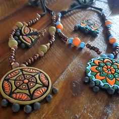 Very Nicely Crafted Artifacts Made With Mud & Bamboo. Beautiful Jewelry Made By Rural Women In Bangladesh. Artistic Jewelry For Jewelry Making And Festivals, Artistic Brown Jewelry For Festival, Artistic Handmade Orange Jewelry, Artistic Hand Painted Brown Jewelry, Terracotta Jewellery Designs, Rural Women, Pearl Lariat Necklace, Red Beaded Necklaces, Terracotta Jewellery